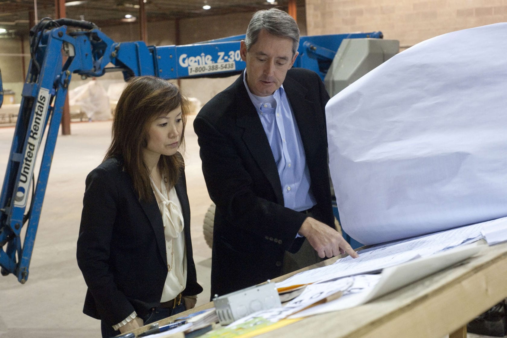 Mei and her COO Dale Williams feeling discouraged about the American factory (2011).